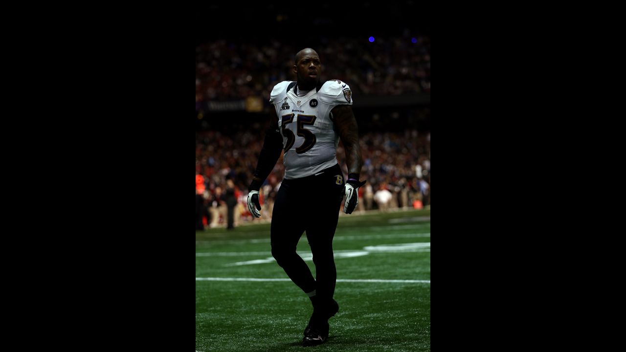 Terrell Suggs of the Baltimore Ravens paces on the field during the power outage.