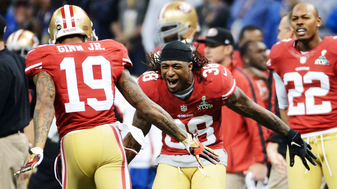 Ted Ginn Jr., left, of the San Francisco 49ers celebrates with teammate Dashon Goldson after a long punt return.