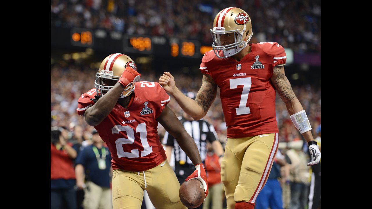Frank Gore, left, and Colin Kaepernick of the 49ers celebrate after Gore scored a 6-yard rushing touchdown in the third quarter.