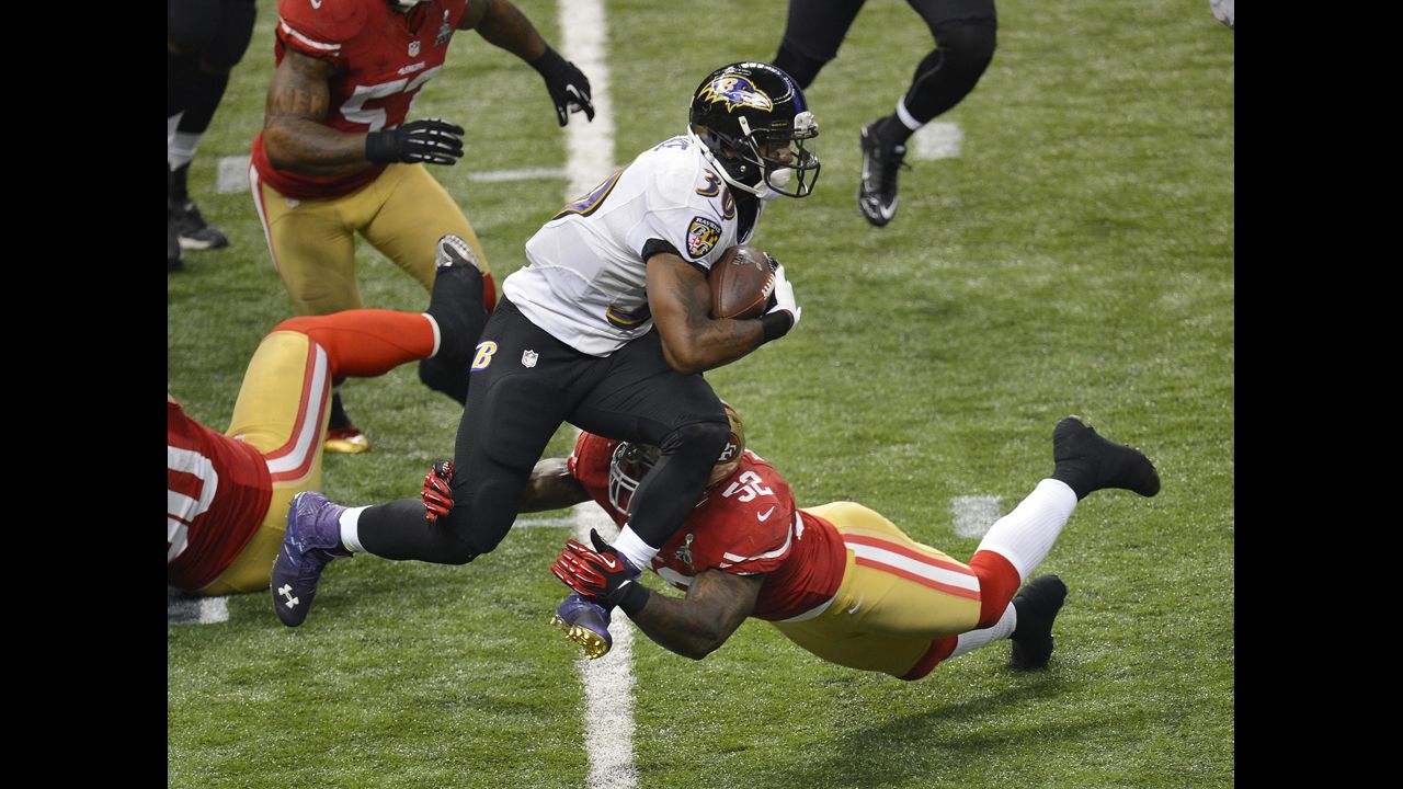 Patrick Willis of the San Francisco 49ers makes contact with Bernard Pierce of the Baltimore Ravens.