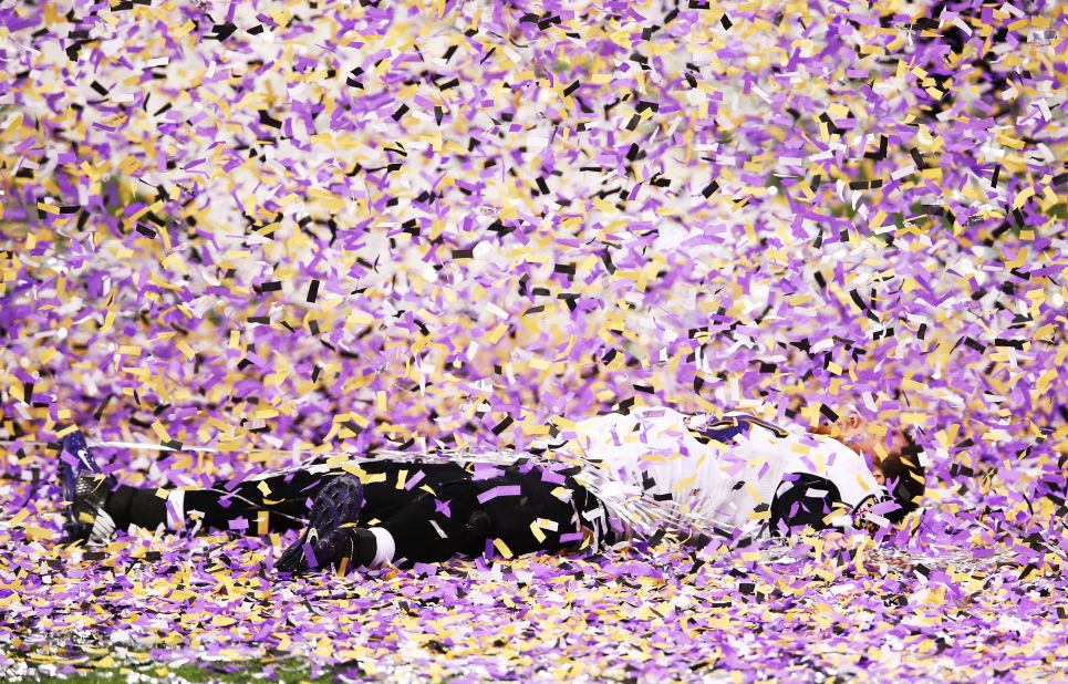 Morgan Cox of the Baltimore Ravens lies on the field while celebrating after defeating the San Francisco 49ers 34-31 in Super Bowl XLVII at the Mercedes-Benz Superdome on Sunday, February 3, in New Orleans, Louisiana.