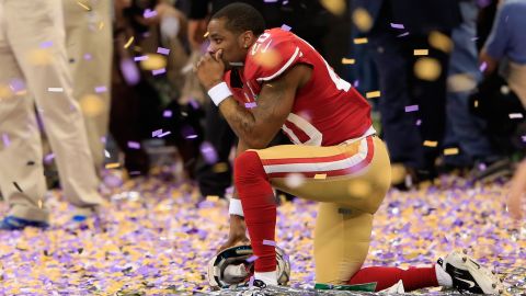 Cornerback Perrish Cox of the San Francisco 49ers kneels down among the confetti following his team's loss.