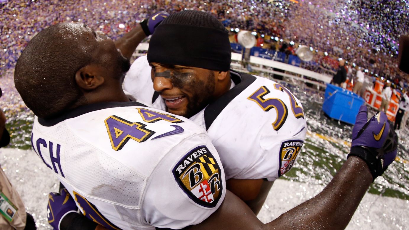 Vonta Leach, left, and Ray Lewis of the Baltimore Ravens celebrate on the field after the game.