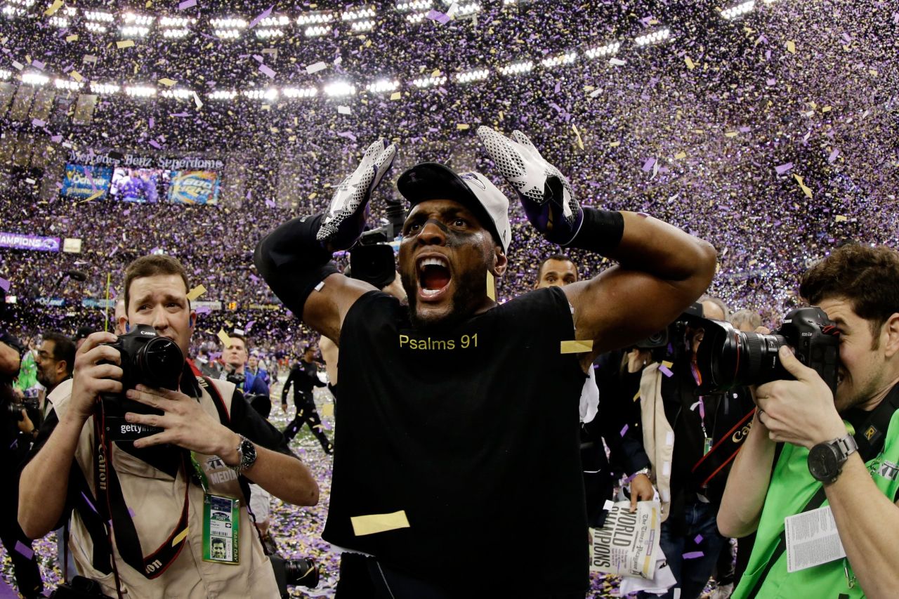 Retiring linebacker Ray Lewis of the Baltimore Ravens celebrates as confetti falls after the game.