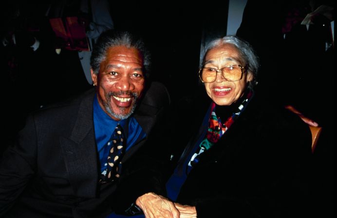 Actor Morgan Freeman joins Parks at a film premiere party for "Amistad" in 1997.