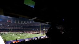 Fans look on to the field after a sudden power outage in the second quarter during Super Bowl XLVII at the Mercedes-Benz Superdome on February 3, 2013 in New Orleans
