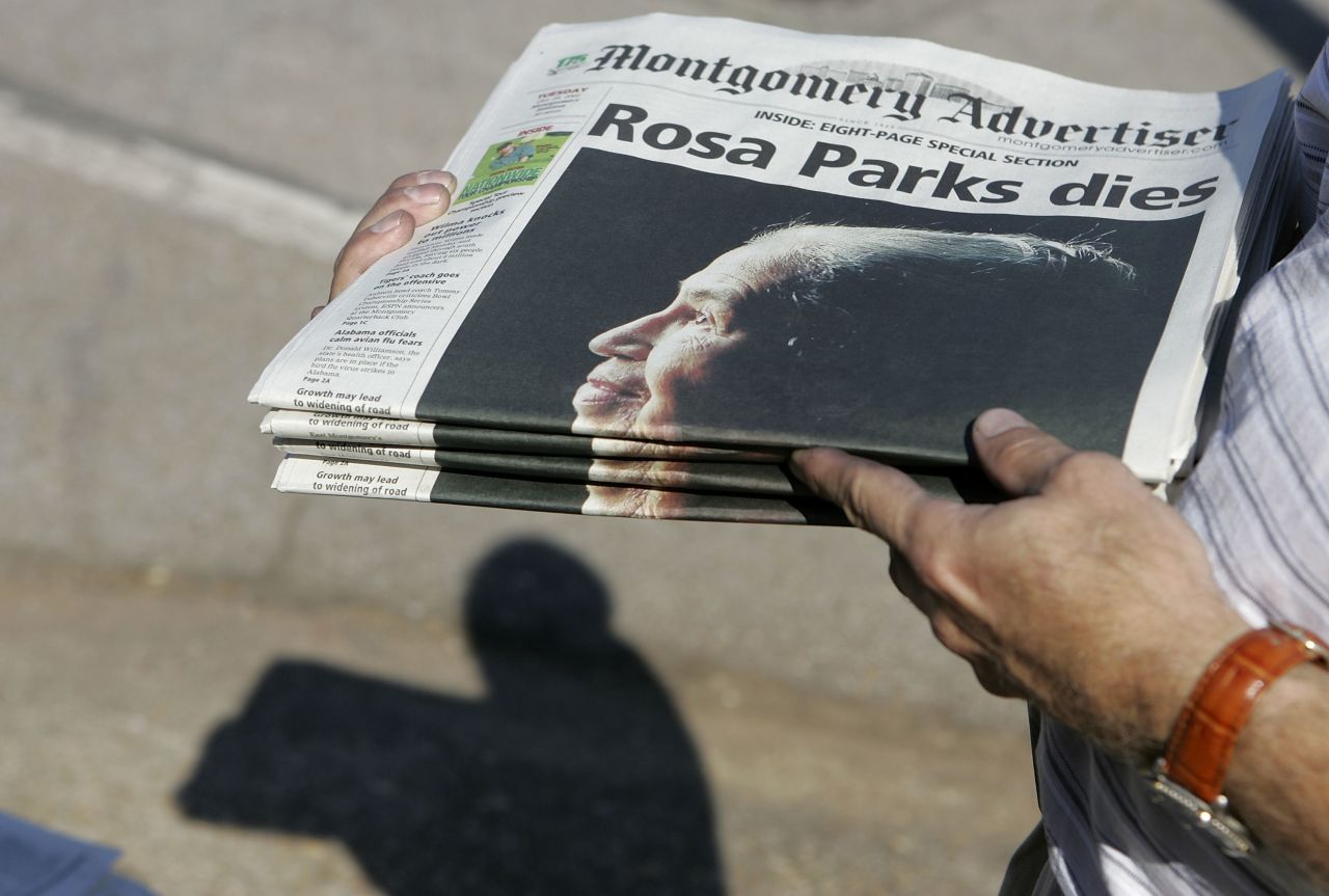 Free copies of The Montgomery Advertiser get handed out before a memorial service for Parks on October 28, 2005. She had died four days earlier at the age of 92.