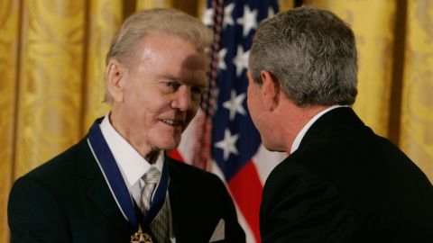 President George W. Bush presents Paul Harvey, left, with the Medal of Freedom at the White House November 9, 2005.
