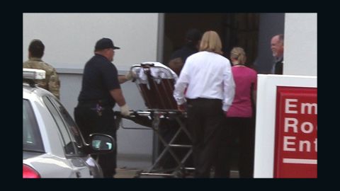 Ethan, the rescued boy, arrives on stretcher Monday at Flowers Hospital in Dothan, Alabama.