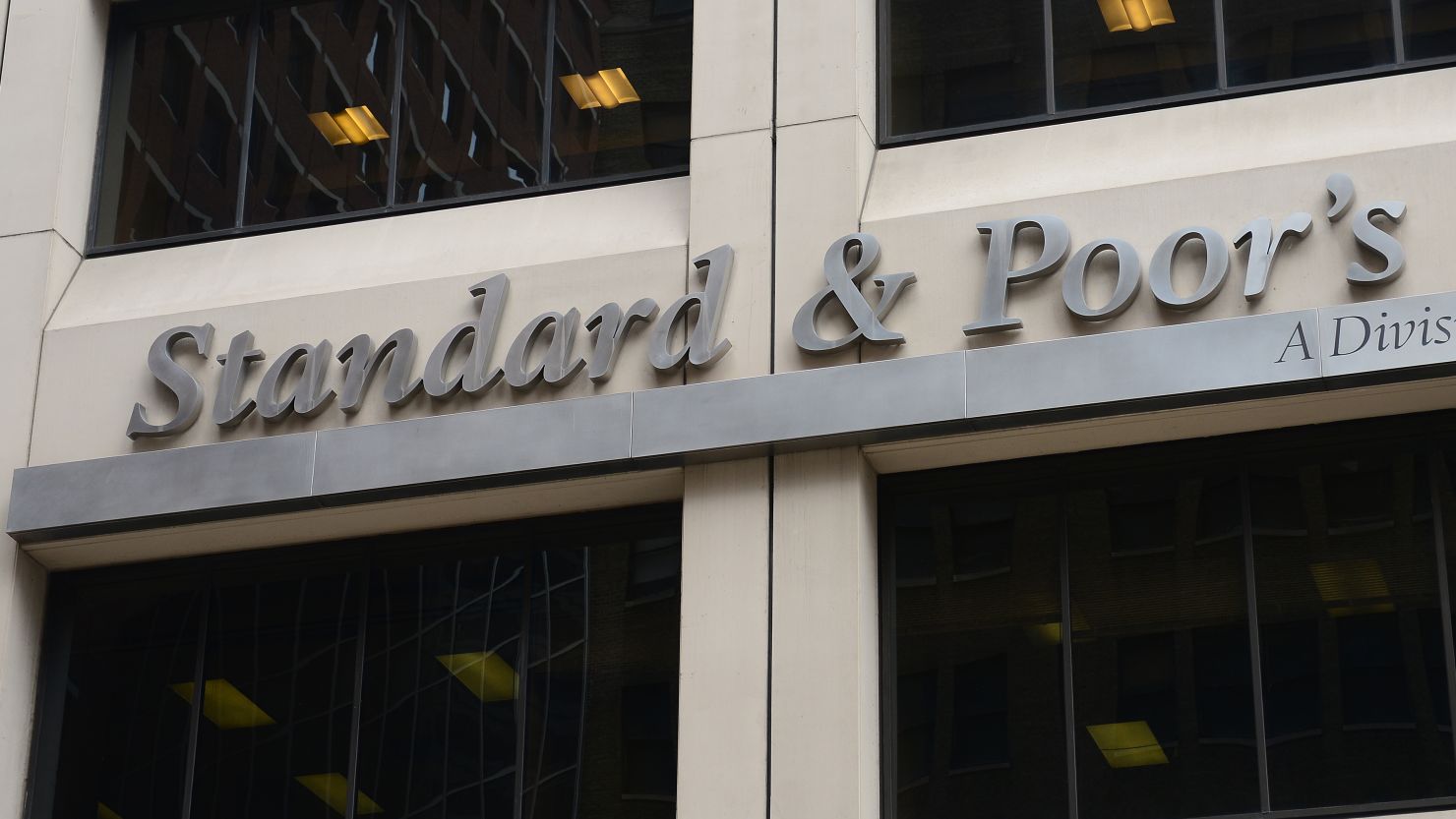 A sign for Standard & Poor's rating agency stands in front of the company headquarters in New York, September 18, 2012. 
