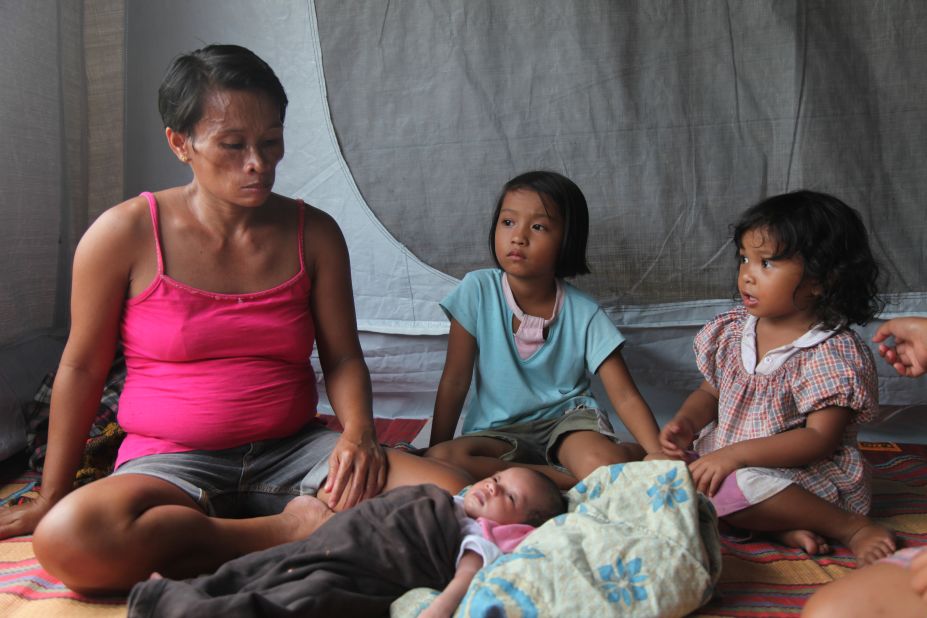 Lydia Inungam, 38, lives with her family in a tent after recently giving birth to her seventh child. Her village of wood and bamboo huts was flattened by the typhoon.
