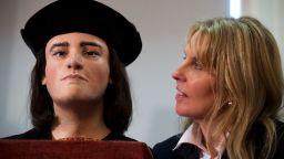 Philippa Langley stands besides a facial reconstruction of King Richard III on February 5, 2013 in London.