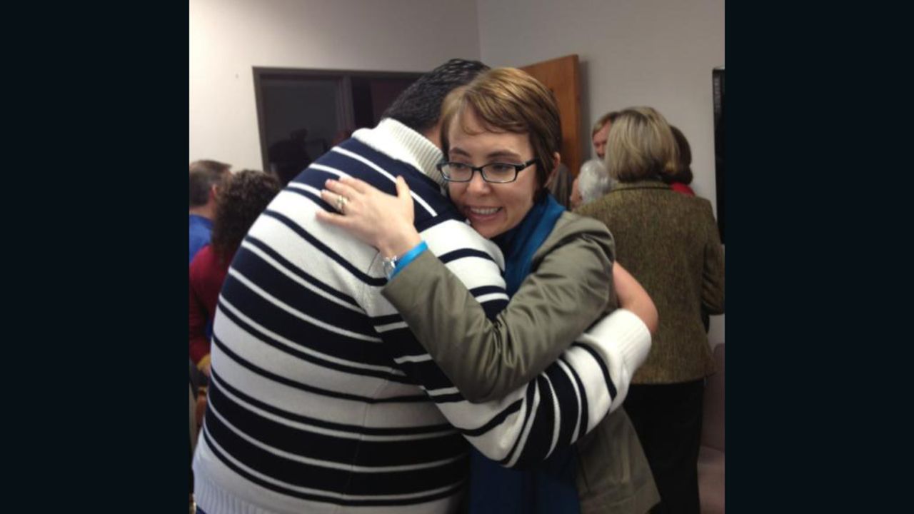 Gabby Giffords hugs Daniel Hernandez Jr. on the first anniversary of the Tucson shooting