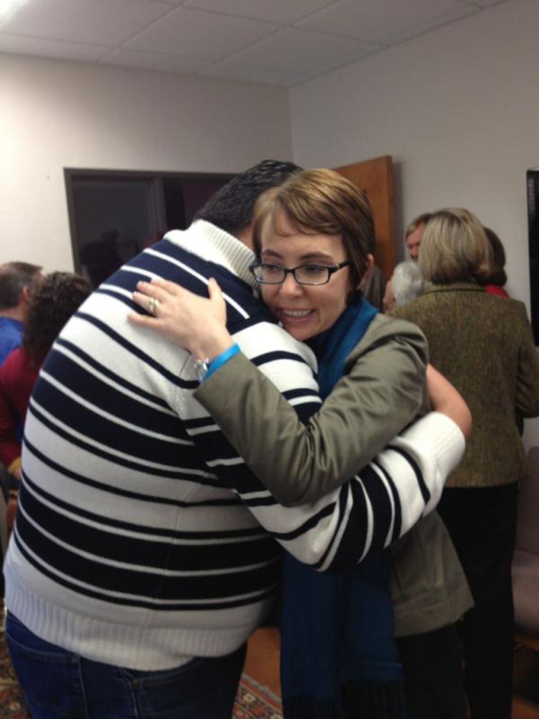 Gabby Giffords hugs Daniel Hernandez Jr. on the first anniversary of the Tucson shooting