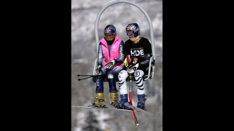 Kildow rides the lift with Maria Riesch of Germany during training for the FIS Alpine Skiing Women's World Cup Race on December 8, 2005, in Aspen, Colorado.  
