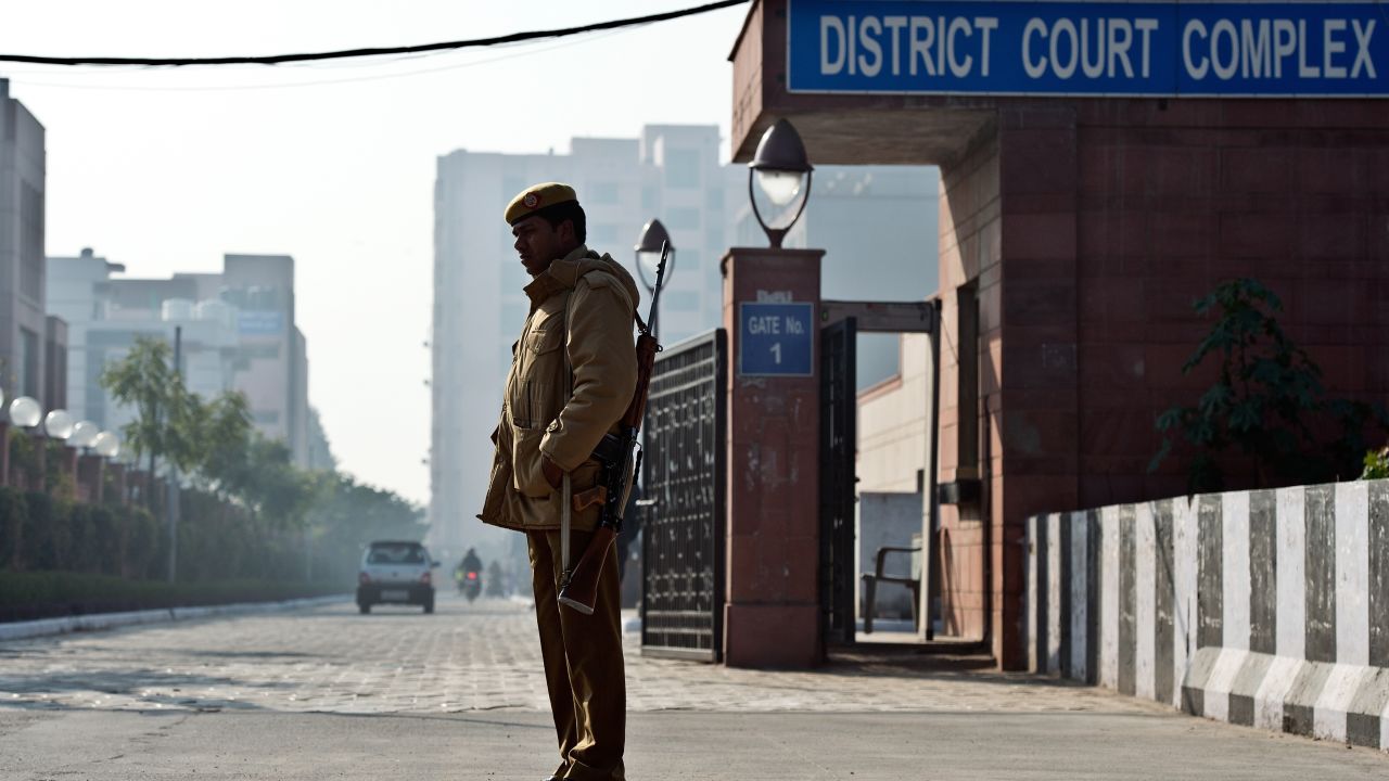 Indian police stand guard outside the Saket district court in New Delhi on January 21.