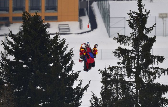 Vonn is lifted by a helicopter during the women's super-G event during the Alpine FIS Ski World Championships on Tuesday, February 5, 2013, in Schladming, Austria. 