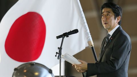 Japanese PM Shinzo Abe delivers a speech on February 2 on Okinawa near the disputed islands.