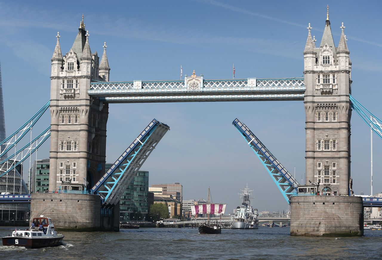Tower Bridge opens its arms to the sailboat, which made a second journey last year from Sardinia to Britain. The voyage retraced the ancient Phoenician trading route with the Cornish.