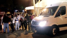 Police escort a van with twelve Spanish citizens and a Mexican woman in Acapulco on February 4, 2013.