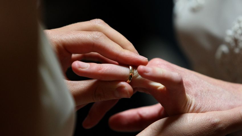 Sharon Papo places a ring on the finger of her partner Amber Weiss as they are married at San Francisco City Hall June 17, 2008 in San Francisco, California. Same-sex couples throughout California are rushing to get married as counties begin issuing marriage license after a State Supreme Court ruling to allow same-sex marriage. (Photo by Justin Sullivan/Getty Images) 