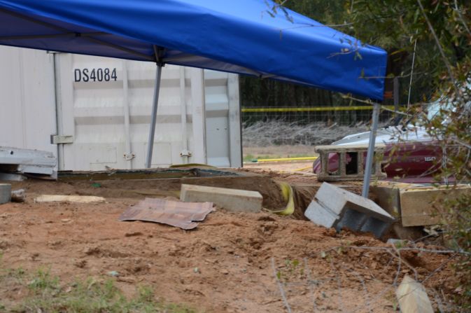 A tent covers the bunker where the standoff took place. An FBI team rescued the child and killed Dykes during the operation on  February 4.