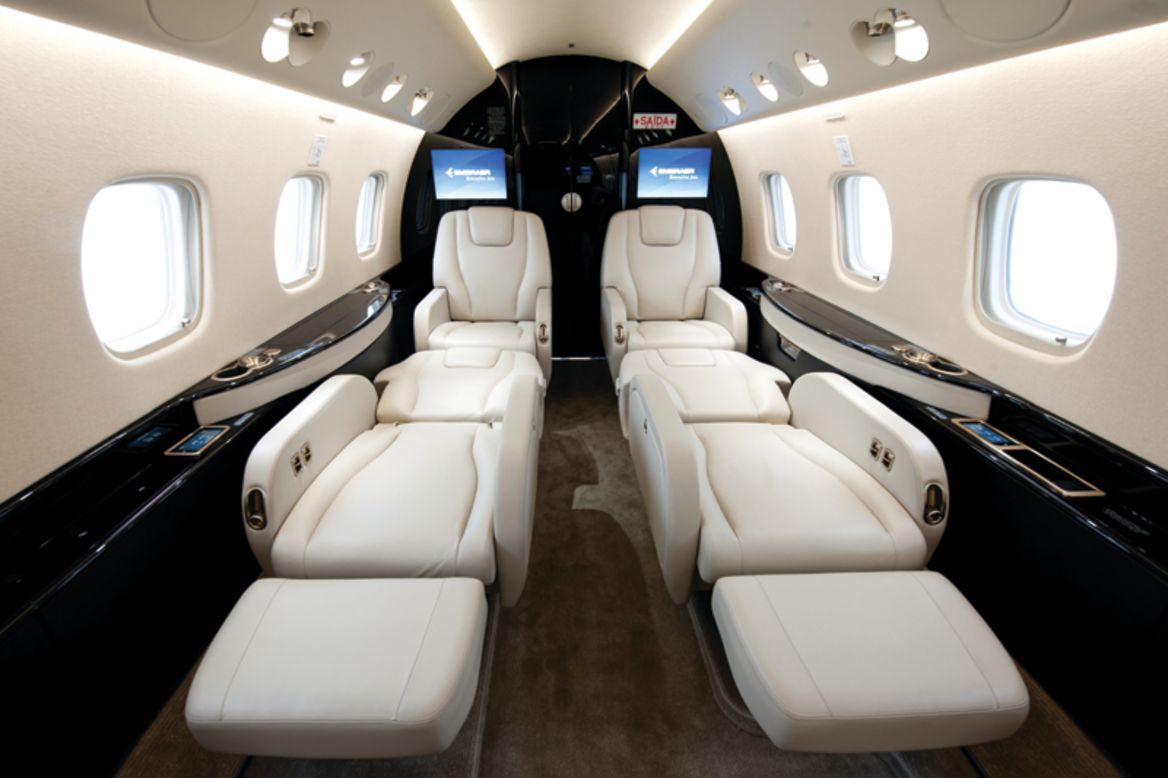 The Legacy 650 cabin includes a galley, high-speed broadband WiFi, Iridium satellite phone, iPod/iPhone docking systems, 32-inch HD LCD video monitor, Blu-ray disc players, front and rear lavatory and a 240 square-foot baggage compartment. Cabin height: 6 feet. Cabin length: 42.4 feet. Source: Embraer.