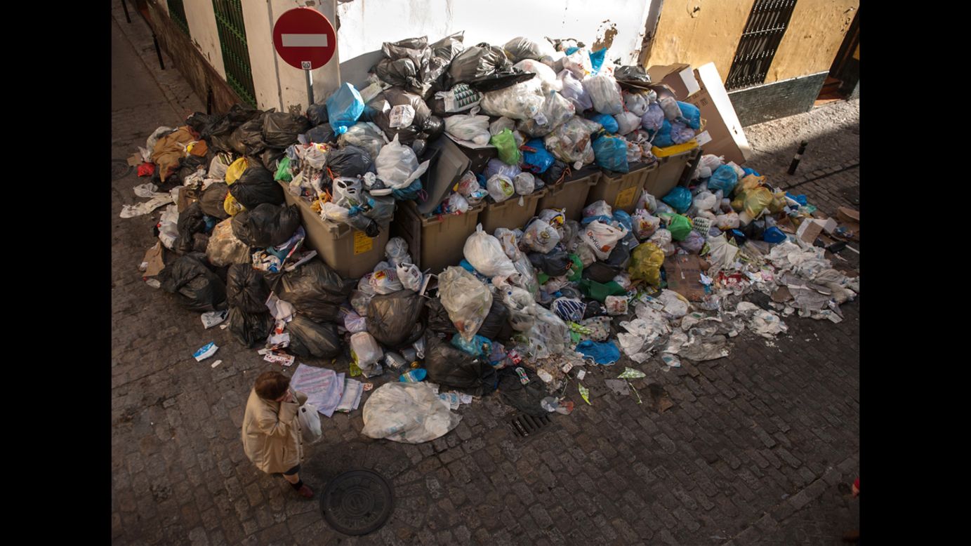A large pile of garbage fills the corner of a street in Seville, Spain, on Wednesday, February 6.