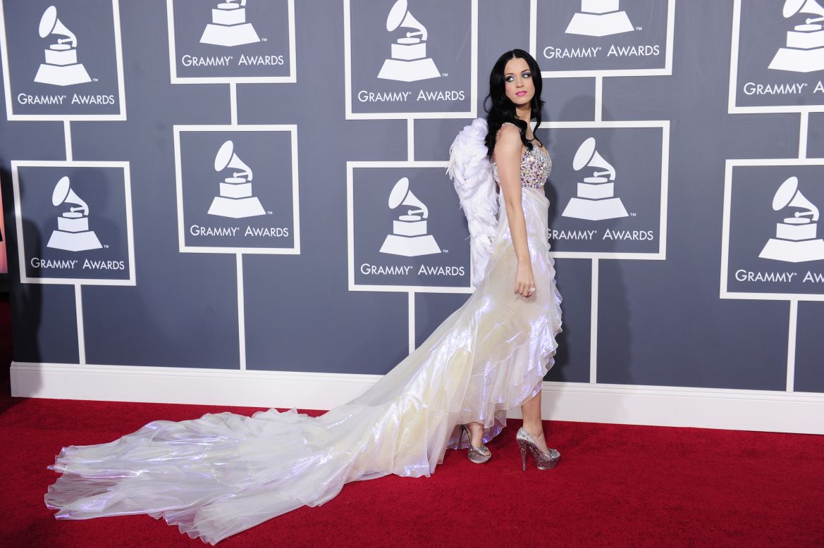 Katy Perry's 2011 red carpet look included a sparkly bra top and wings.