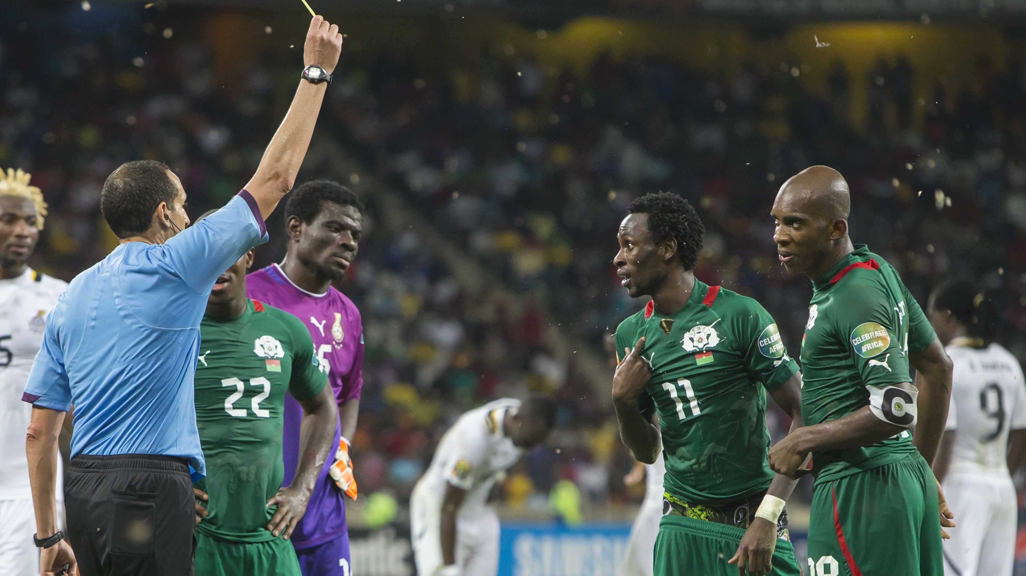 Burkina Faso's Jonathan Pitroipa is shown a second yello card in his side's semifinal win over Ghana.