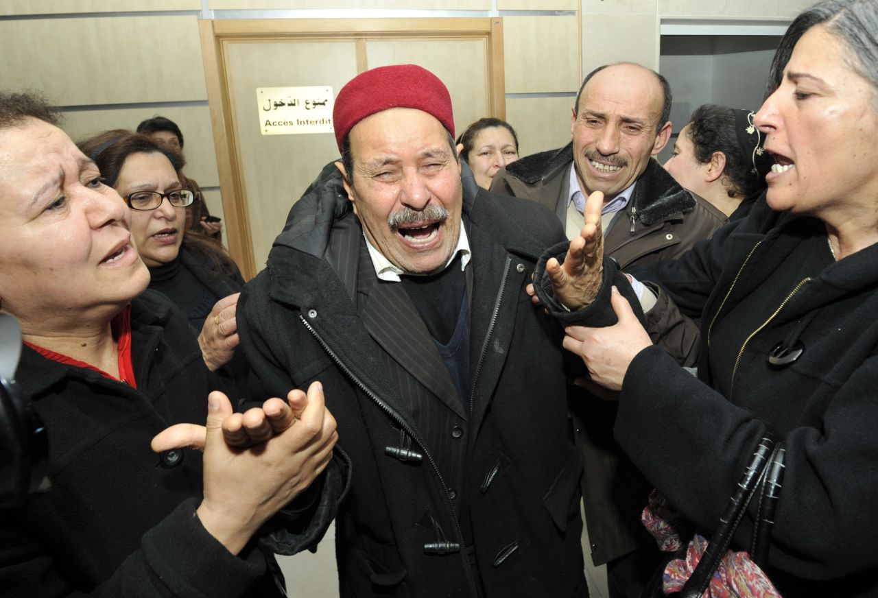 The father of assassinated Tunisian opposition leader and outspoken government critic Chokri Belaid mourns after his killing on February 6, 2013, at a clinic in Tunis.