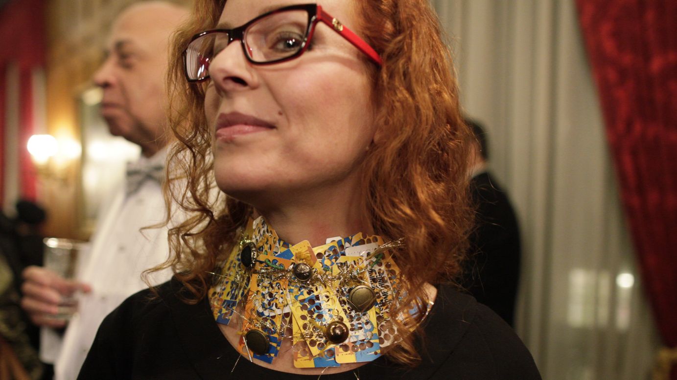 A woman wears a necklace made from New York MetroCards on February 6 at a show touting Russia's textile and apparel industry.