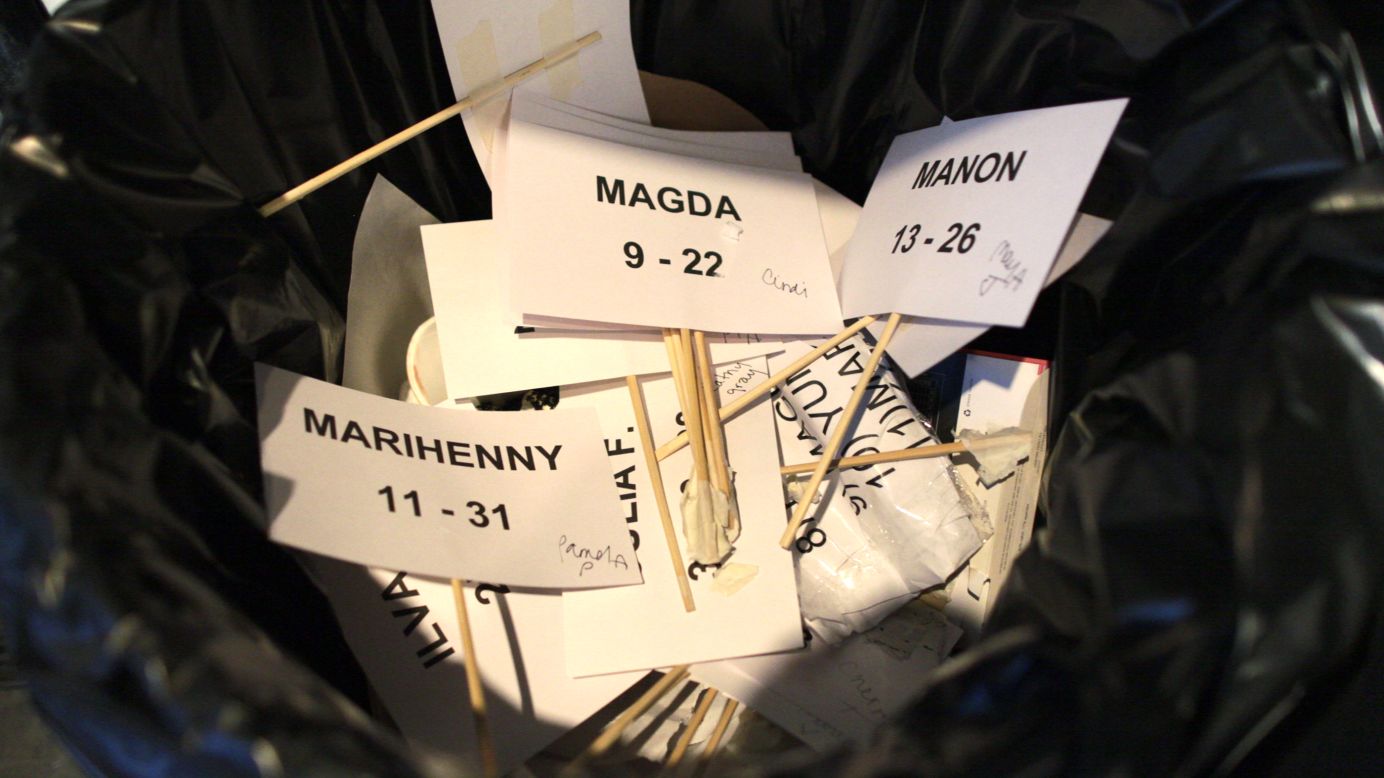 Discarded model name tags pile up in the trash after the Tadashi Shoji show on February 7.