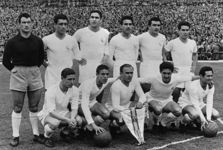 The Real Madrid team poses for a photograph ahead of the second leg of the European Cup semifinal against Manchester United at Old Trafford in 1957 with captain Alfredo Di Stefano clutching his side's pennant.