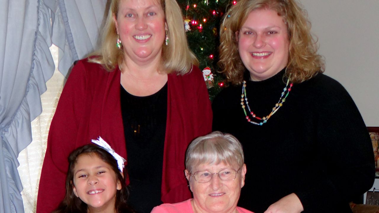 Tabitha McMahon, top right, poses for a holiday photo with her daughter, mother and grandmother. 