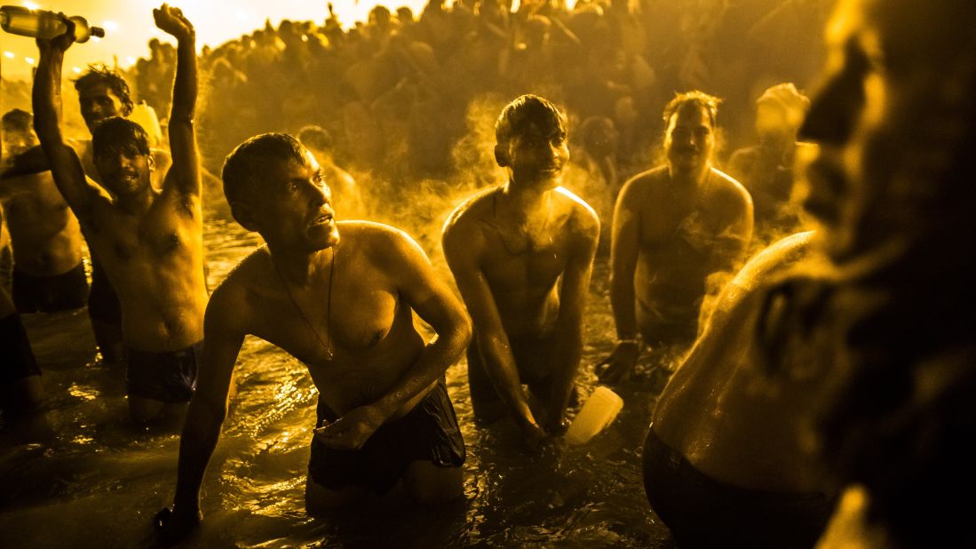 Devotees bathe in the waters of the Ganges.