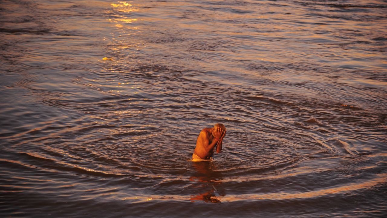 A devotee takes a holy dip at the Sangam, the confluence of the rivers Ganges and Yamuna and the mythic Saraswati on February 7.