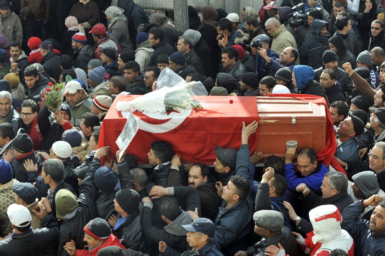 People carry the coffin of late opposition leader Chokri Belaid on February 8, 2013.