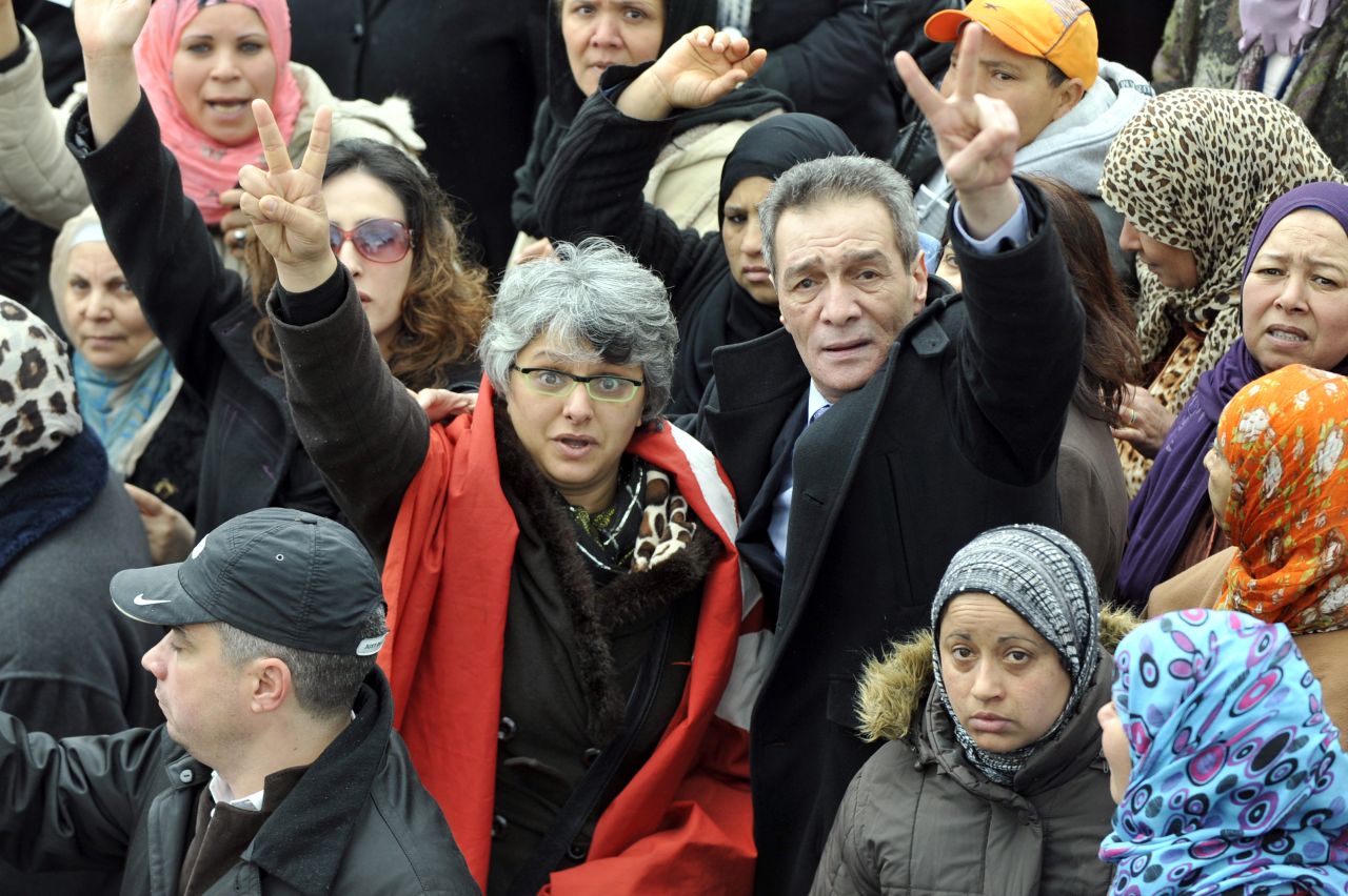 The widow Basma Khalfaoui Belaid flashes the victory sign during the funeral procession of her late husband, opposition leader Chokri Belaid, on February 8, 2013 in Tunis.