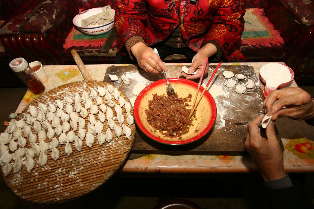 Food is an important part of the celebrations. Here, dumplings are prepared Lunar New Year. 