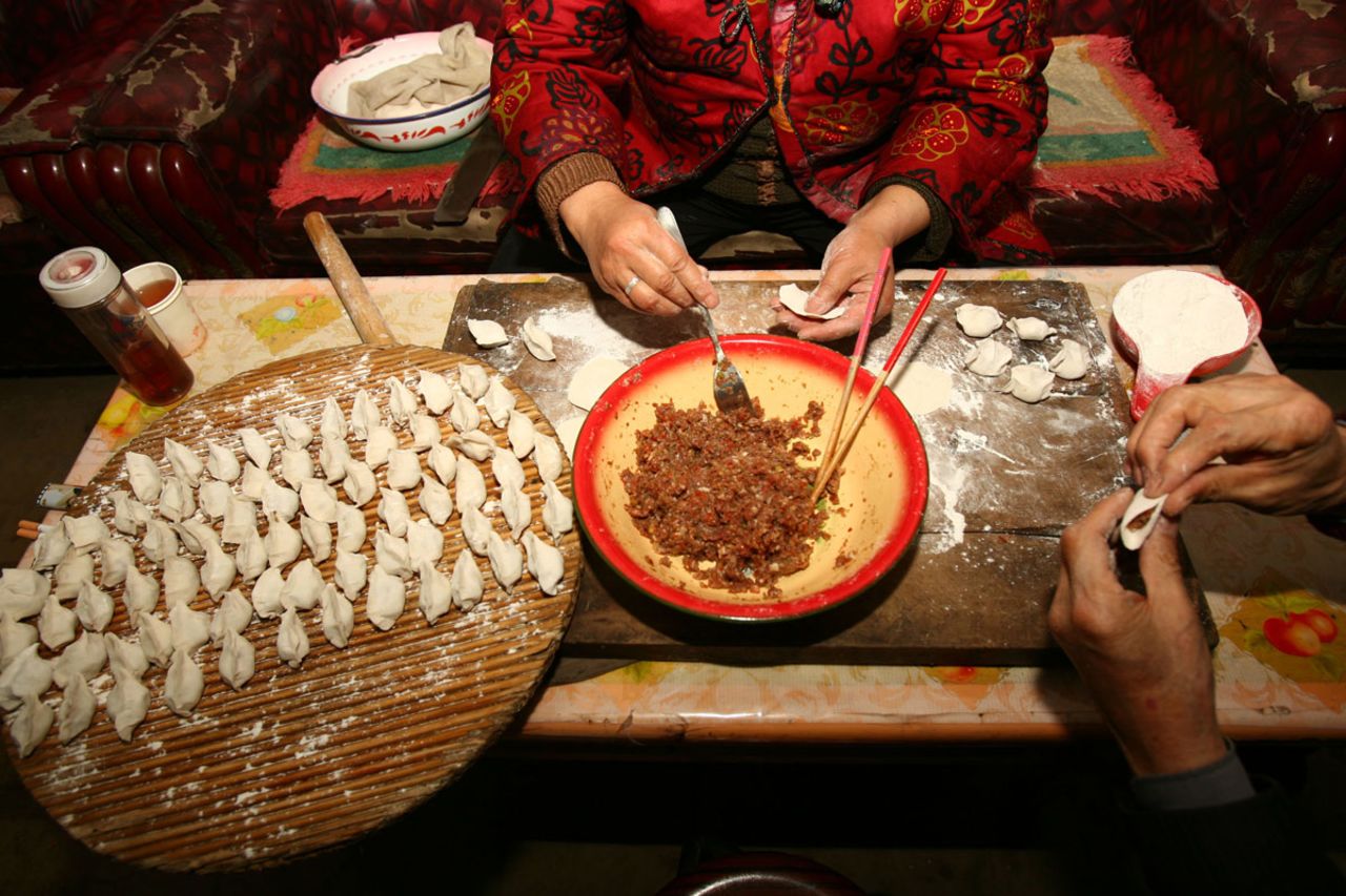 Food is an important part of the celebrations. Here, dumplings are prepared Lunar New Year.