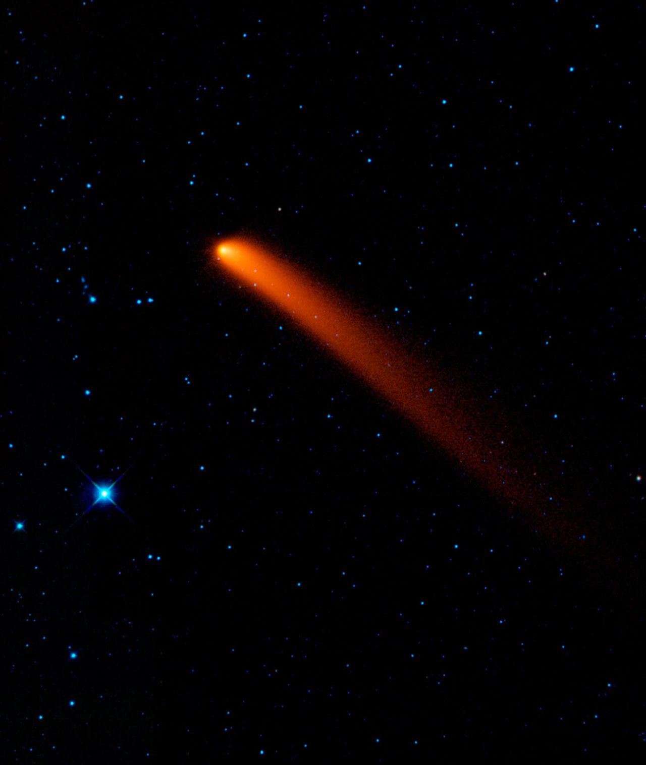 Comet Siding Spring looks like a red blaze in the sky in this infrared image taken on January 10, 2010, from NASA's Wide-field Infrared Survey Explorer (WISE).