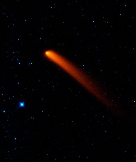 Comet Siding Spring looks like a red blaze in the sky in this infrared image taken on January 10, 2010, from NASA's Wide-field Infrared Survey Explorer (WISE). 