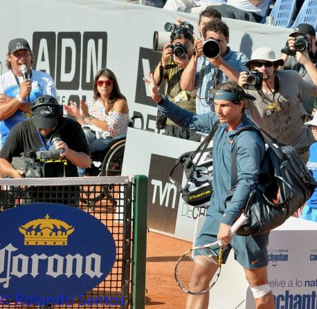 A little after 6 p.m. on a breezy midweek summer evening in Vina del Mar, Chile, Rafael Nadal walked on to the clay court at the 2013 VTR Open after a seven-month injury absence that had many fearing for his career. The whirling click, click, click of cameras and shouts of "Rafa! Rafa!" echoed around the venue as the 11-time grand slam winner walked across the court tight lipped and unsmiling, waving half-heartedly at the crowd.  Rolando Santos was there for CNN with his camera.