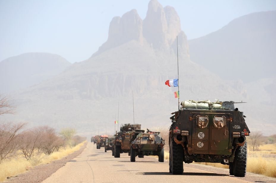 A convoy of French army vehicles head toward Gao on February 7. France is mulling over when to hand off its four-week-old intervention to U.N. peacekeepers. 