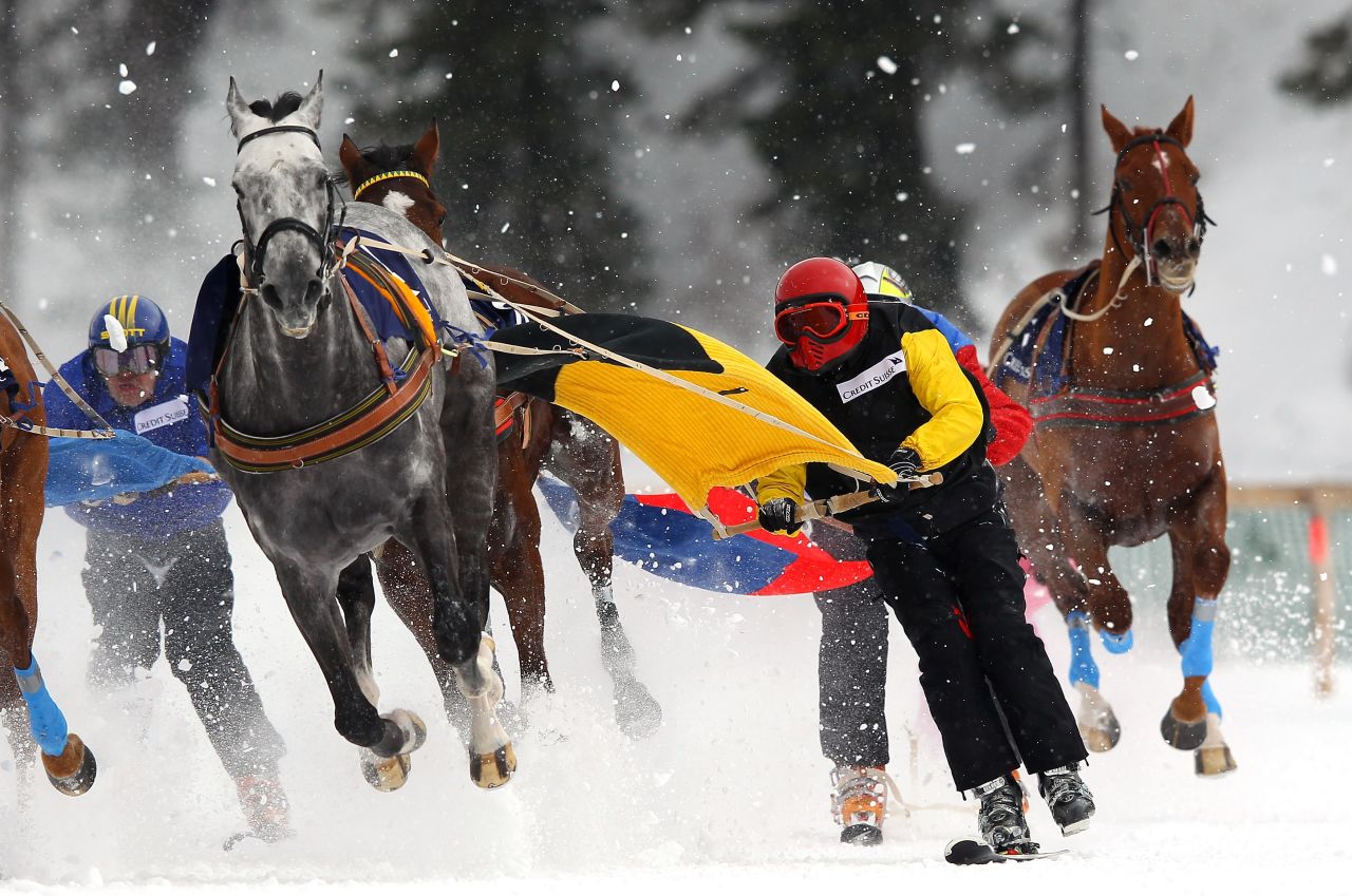 Competitors race in the Skijoring event. "We have not got that much control," said six-time champion Franco Moro. "Around 20% is the driver's responsibility and 80% is the horse."