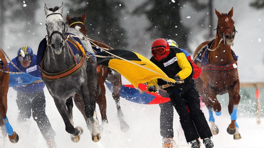 Competitors take part in the Skikjoring Trophy race during the White Turf horse racing meeting held on the frozen Lake St Moritz on February 19, 2012 in St Moritz, Switzerland.