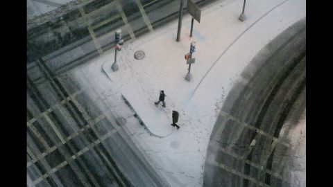People walk through the snow in Boston's Back Bay neighborhood on Friday.