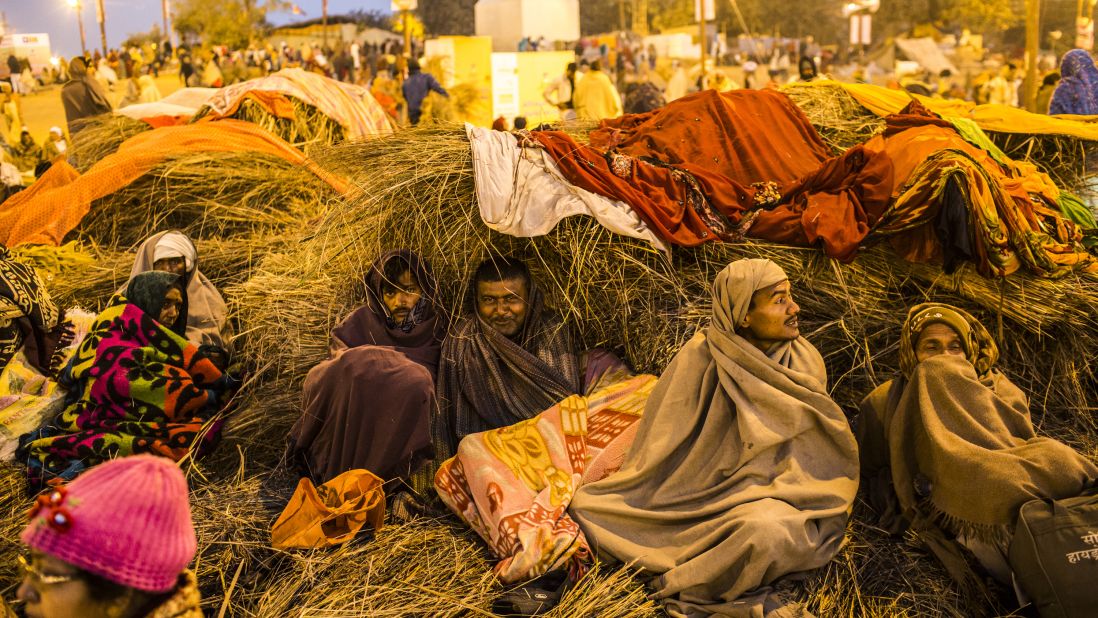 Devotees warm themselves early in the morning before taking a bath on the banks of Sangam on February 9.