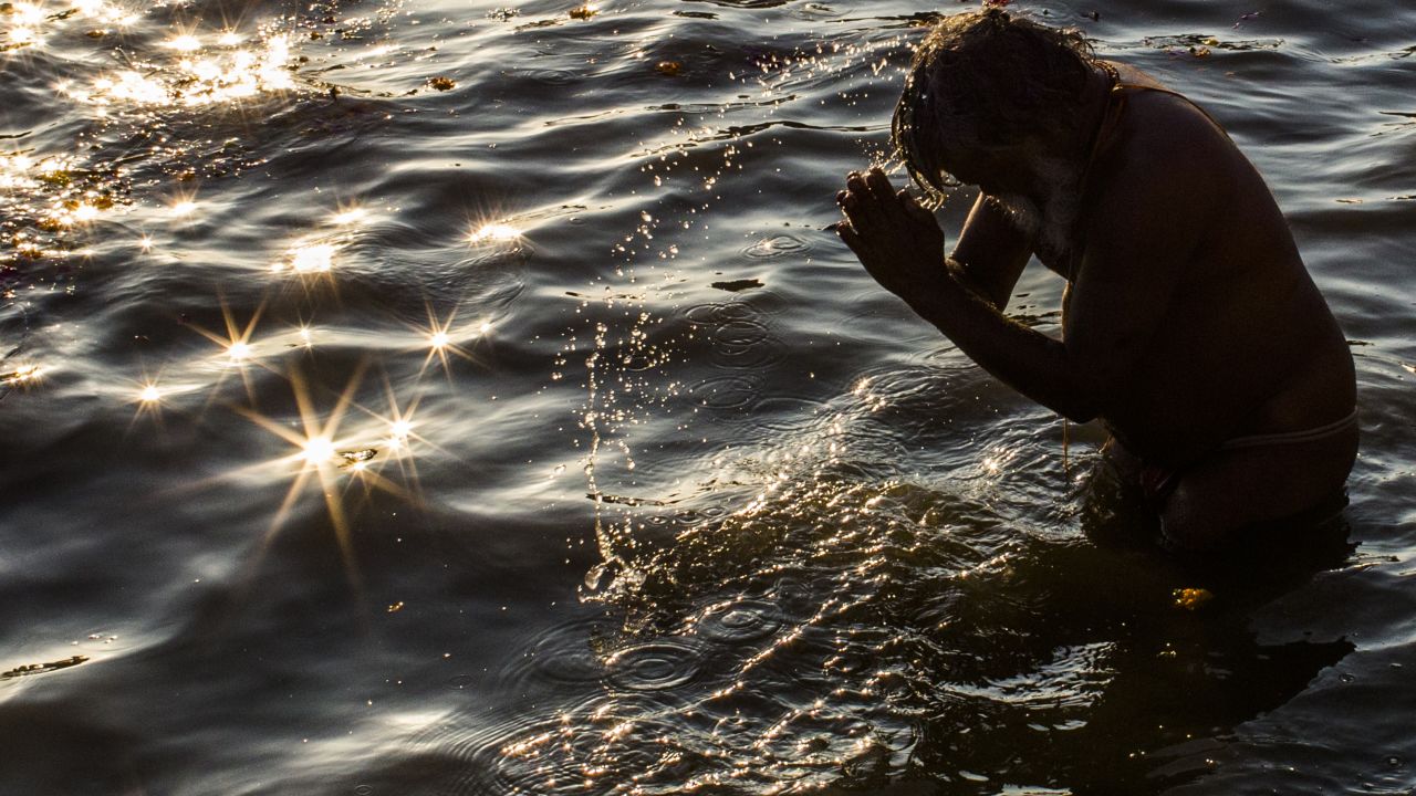 A devotee bathes in the Sangam on February 9.